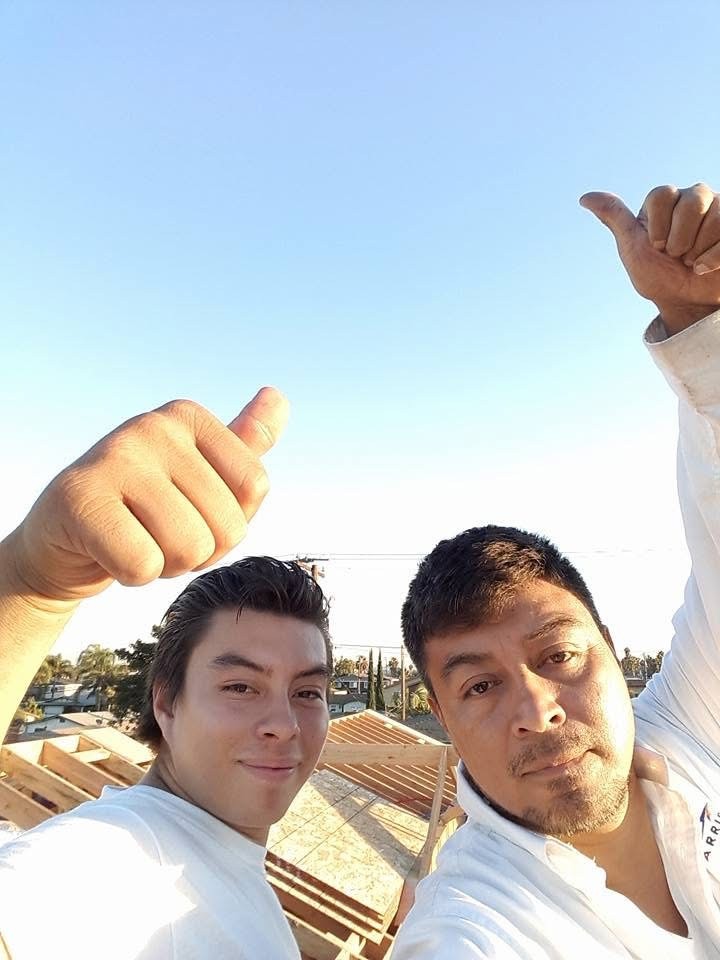 Albert Jr. on a rooftop with his father learning HVAC in Orange County.