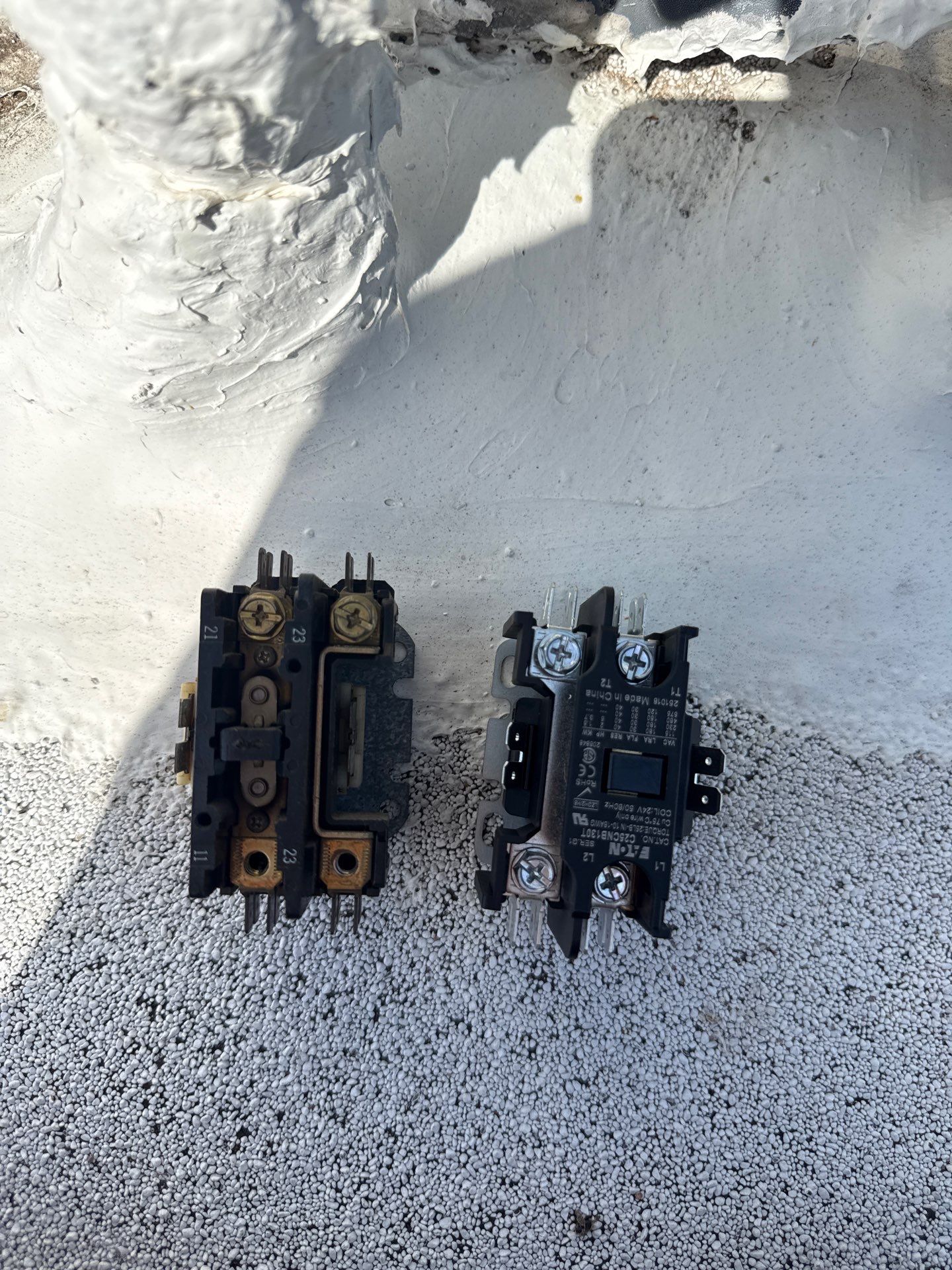 A burnt contactor next to its replacement, found by VORXS during an AC tune-up in Orange County