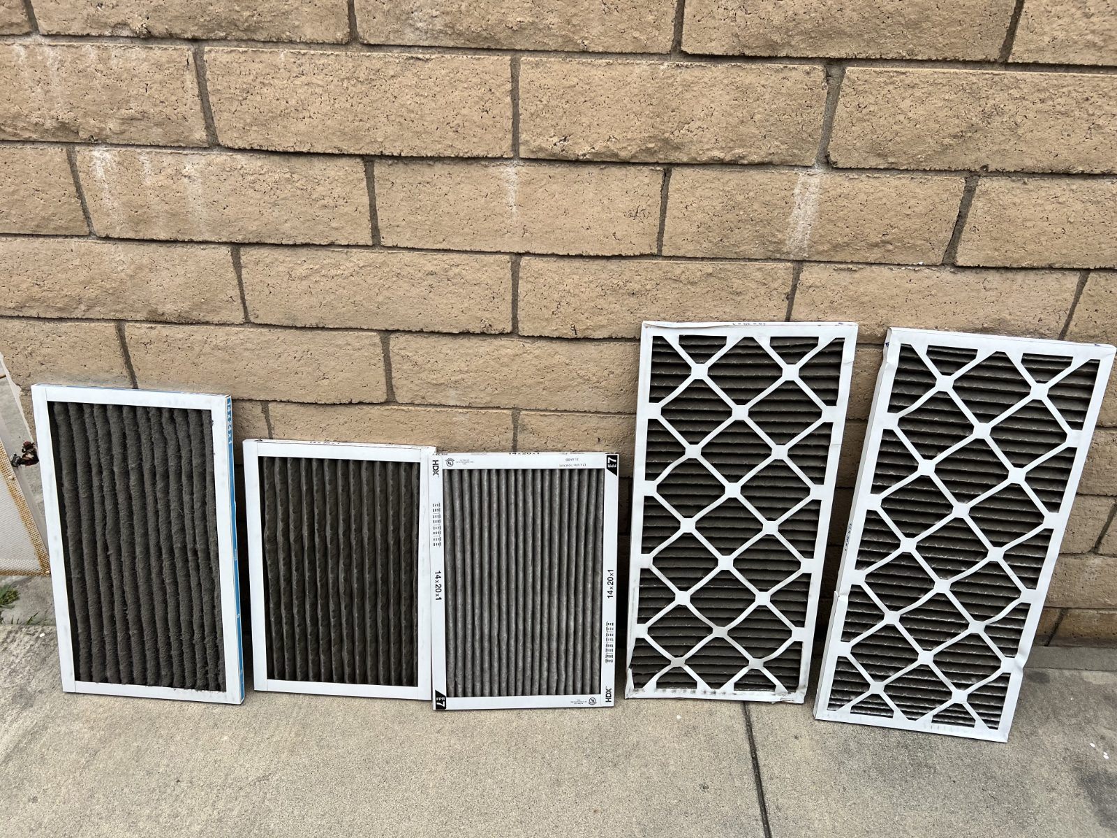 Dirty, dust-clogged HVAC filters pulled from Orange County homes during service
