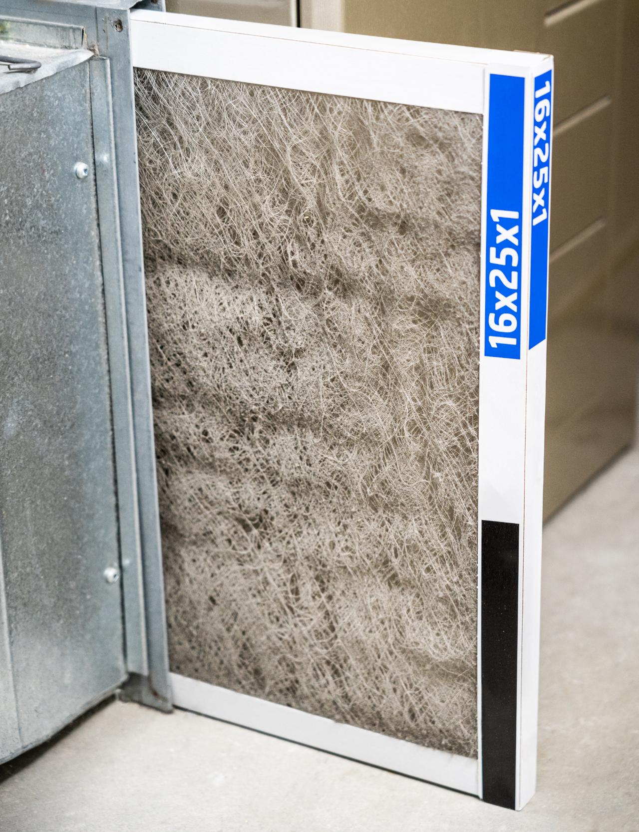 A clogged 16x25x1 furnace filter pulled from the return