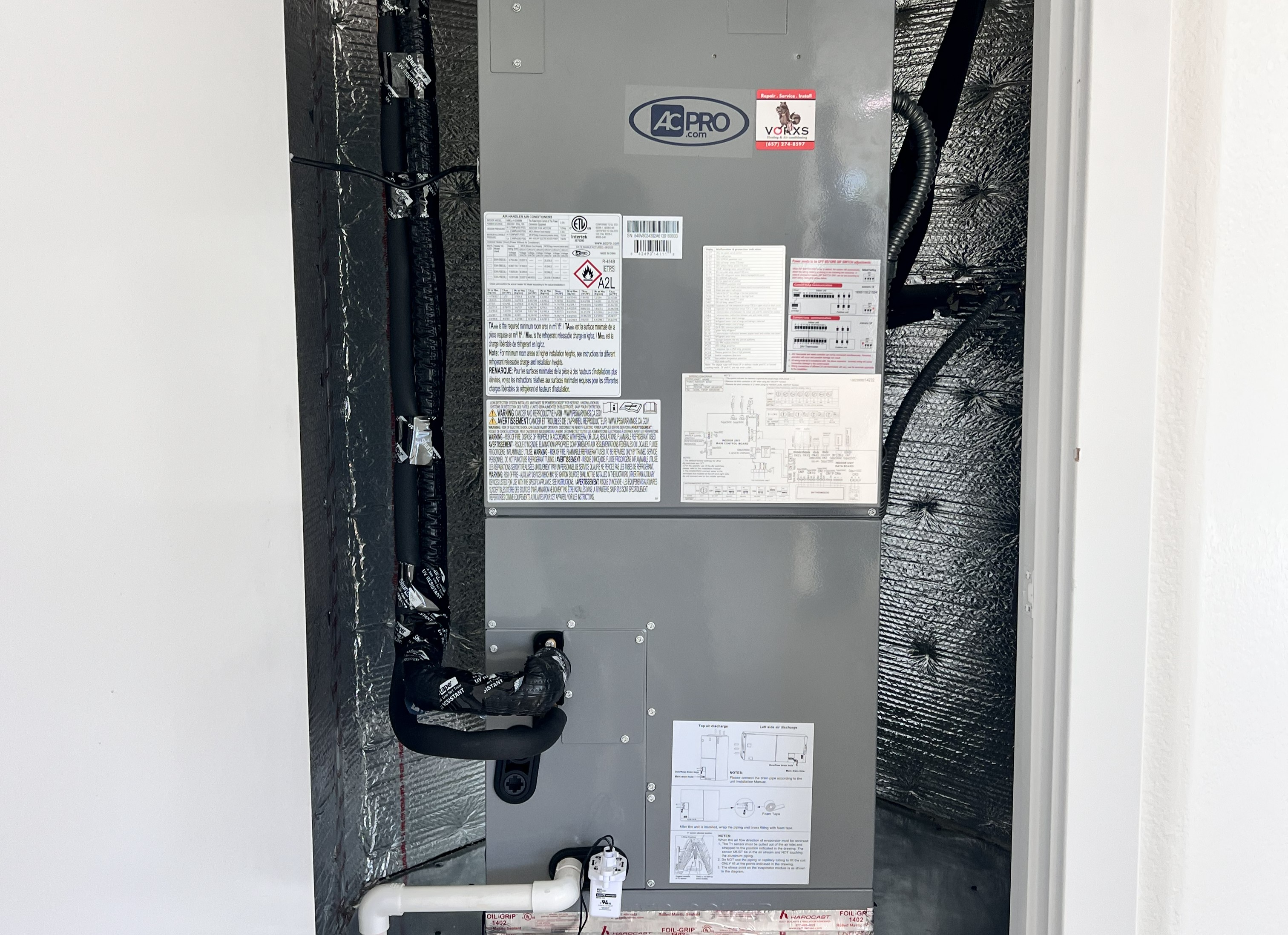 AC Pro air handler with VORXS sticker · heat pump install · Santa Ana home