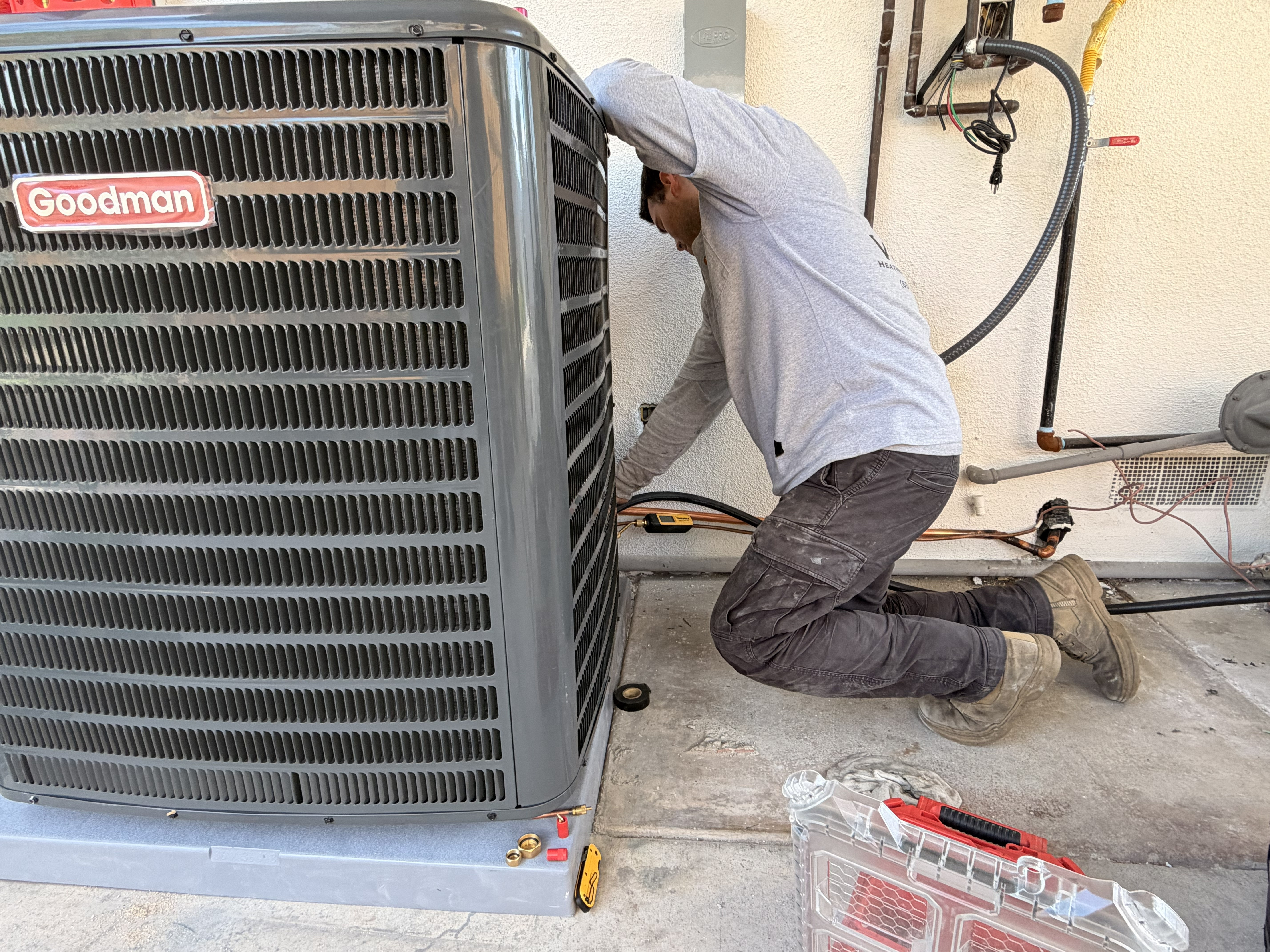 VORXS tech checking refrigerant pressure on a home AC unit · Santa Ana